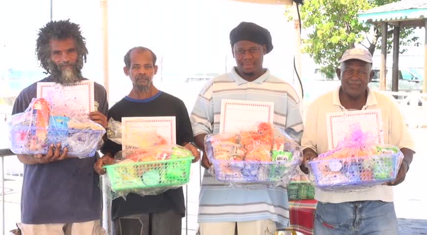 Sanitation Workers honoured by the Nevis Air and Sea Ports Authority for their contribution to the upkeep of Charlestown (l-r) Donald Browne, Raoul Archibald, Franklyn Browne and George Herbert showing off their certificates of appreciation and gift baskets on December 14, 2015